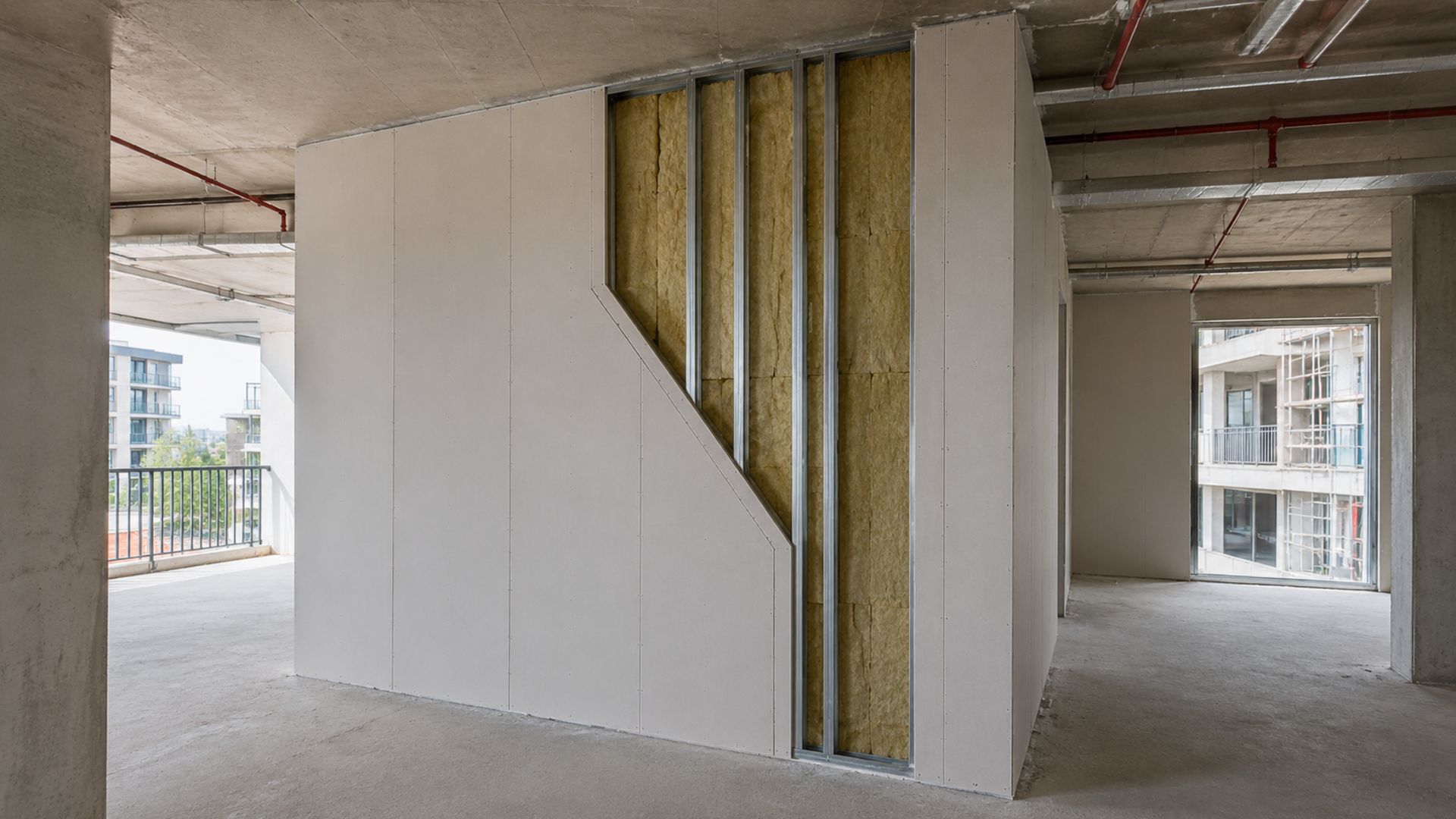 Steel-framed fire rated wall with insulation exposed during construction of a Queensland apartment building